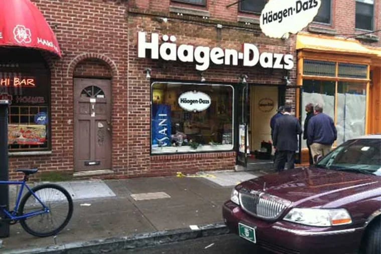 A DJ was shot and killed near his apartment above the Haagen-Dazs ice cream shop on the 200 block of South Street. (Mike Newall / Staff)