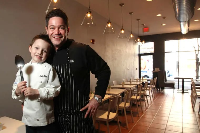 Chef Michael Lynch and Miles, almost 5, in the new restaurant Miles Table on South Street opening Saturday: A cozy, neighborhood-friendly spot with counter service, breakfast all day, and more.