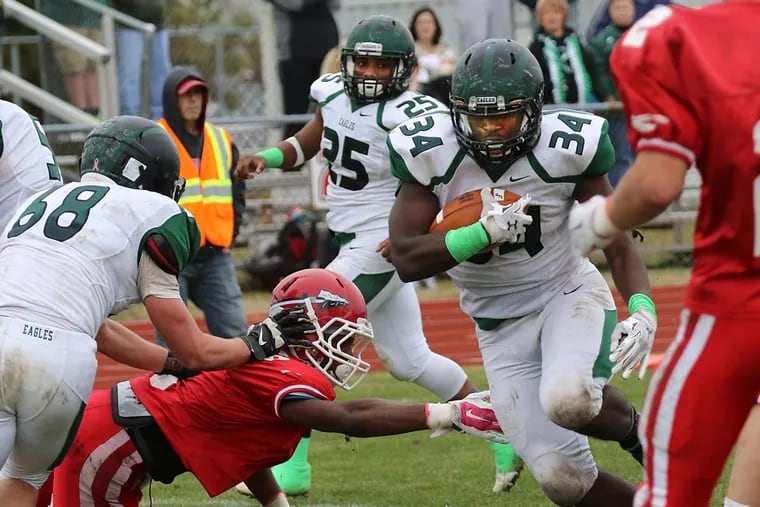 West Deptford's Elijah Pratt finds a hole and bursts through for a 6-yard touchdown in the second quarter against Paulsboro. The extra point gave the Eagles a lead they would never relinquish.