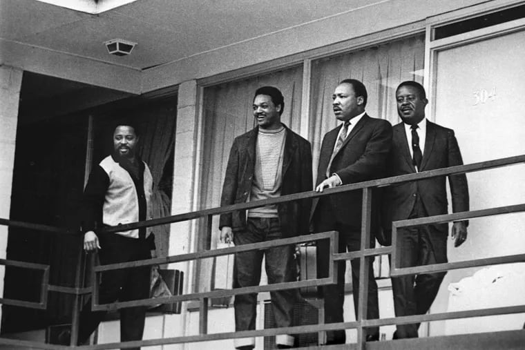 In this April 3, 1968, file photo, the Rev. Dr. Martin Luther King Jr. stands with other civil rights leaders on the balcony of the Lorraine Motel in Memphis, Tenn., a day before he was assassinated in approximately the same place. From left are Hosea Williams, Jesse Jackson, King, and Ralph Abernathy.
