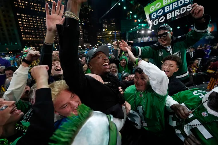 Quinyon Mitchell celebrates with fans after being chosen by the Philadelphia Eagles with the 22nd overall pick during the first round of the NFL draft Thursday.