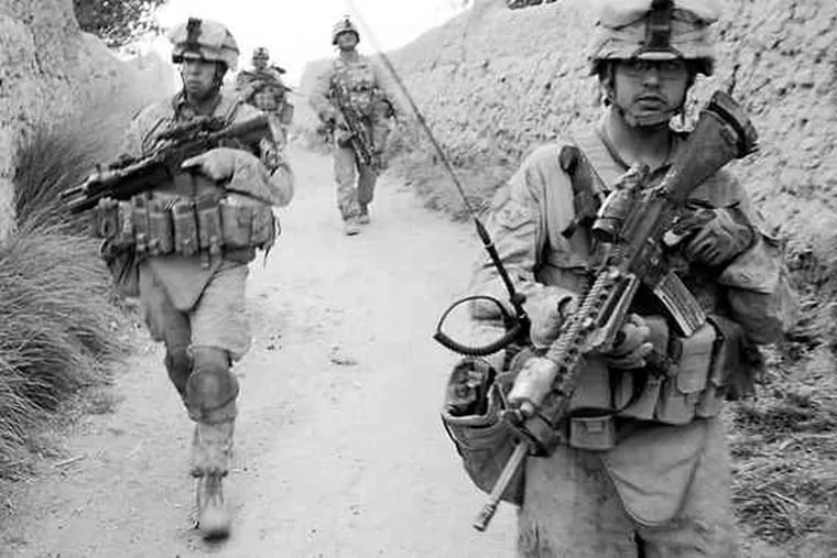U.S. Marines patrol a village in Afghanistan. The troops are part of Operation Khanjari, which was launched to fight the Taliban in southern Helmand Province.
