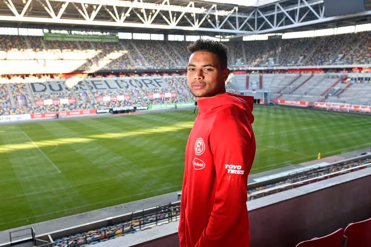Zack Steffen poses for a picture in the stands at Fortuna Düsseldorf's stadium.