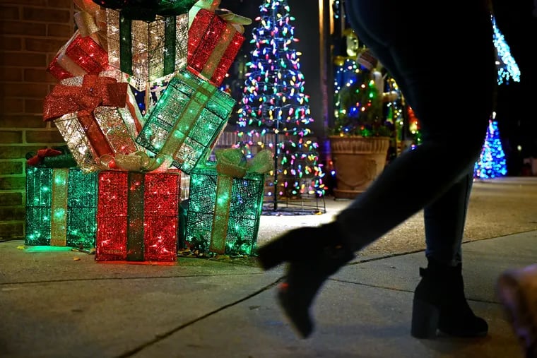 December 20, 2021: Lighted displays along the sidewalk of downtown Collingswood during their holiday shopping.
