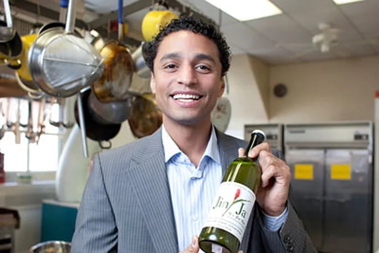 Entrepreneur Reuben Canada with a bottle of his soft drink, Jin-Ja.