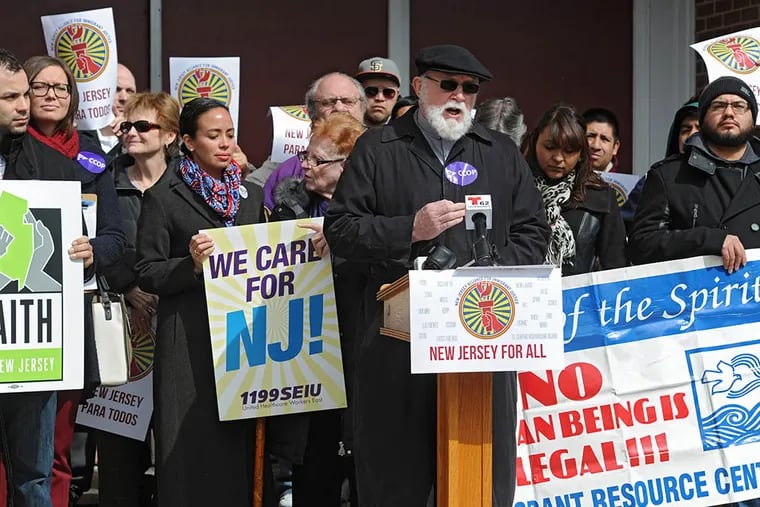 Father Kenneth Hallahan rallies for immigration reform Wednesday at St. Joseph's Pro-Cathedral in Camden. (CLEM MURRAY / Staff Photographer)