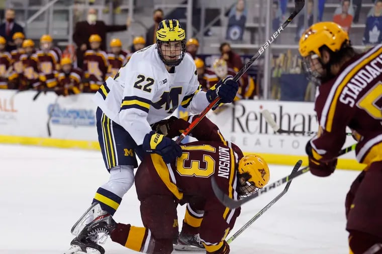 Michigan defenseman Owen Power (left) is expected to be picked No. 1 overall in the NHL draft.