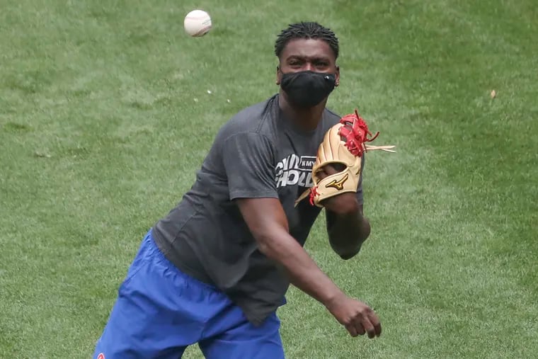 Phillies shortstop Didi Gregorius wears one of the masks he brought to summer camp to try out. He has picked one with a built-in filter.