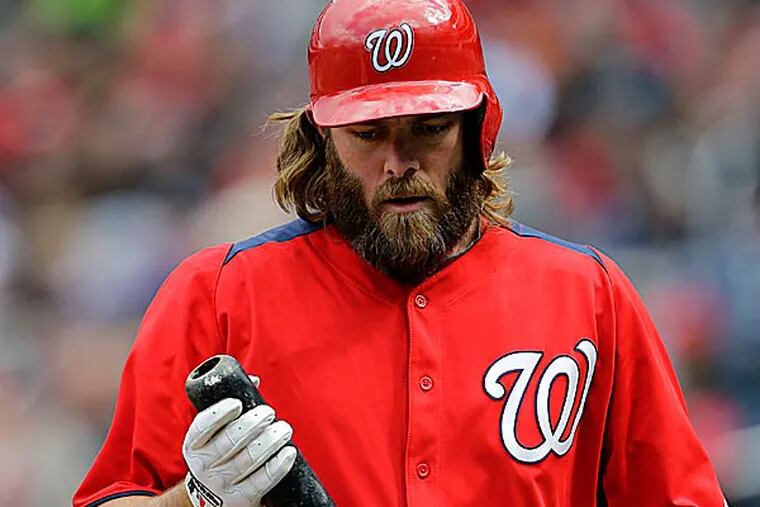 Bryce Harper's first dinger was caught by a Jayson Werth look-alike dressed in a Nationals uniform. (Alex Brandon/AP)