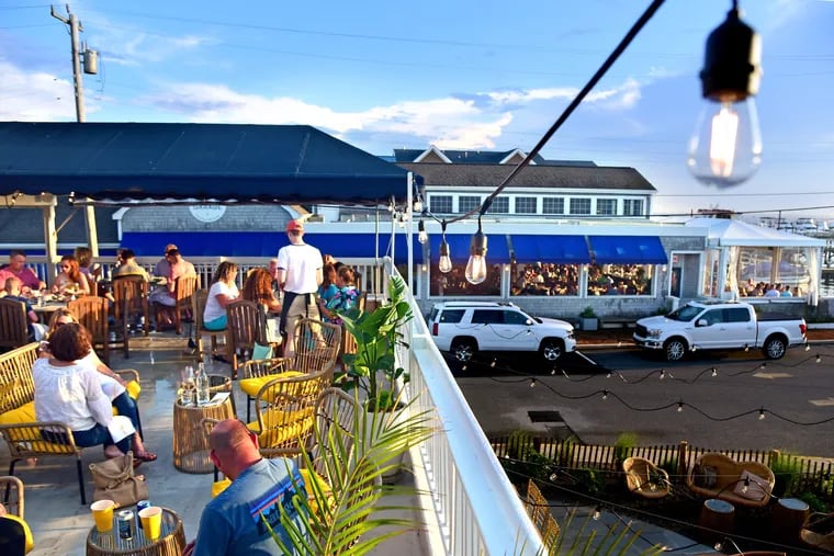 The second floor deck/bar at Bird & Betty’s in Beach Haven June 20, 2019. Parker’s Garage, under the same ownership, is pier side in rear .