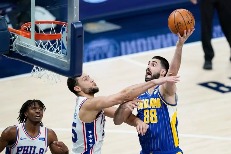 The Indiana Pacers' Goga Bitadze shoots over the 76ers' Ben Simmons.