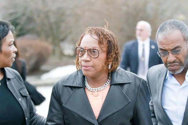Walking from arraignment at Montgomery County District Court in Abington to be processed, state prosecutors bring corruption charges against longtime Philadelphia area legislator LeAnna Washington, Wednesday March 12, 2014. ( DAVID SWANSON / Staff Photographer )