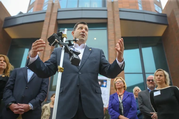 Clergy abuse victim and Pa. State Rep. Mark Rozzi stands with Democratic challengers to local Republican state senators in front of the Bucks County Courthouse on Monday.