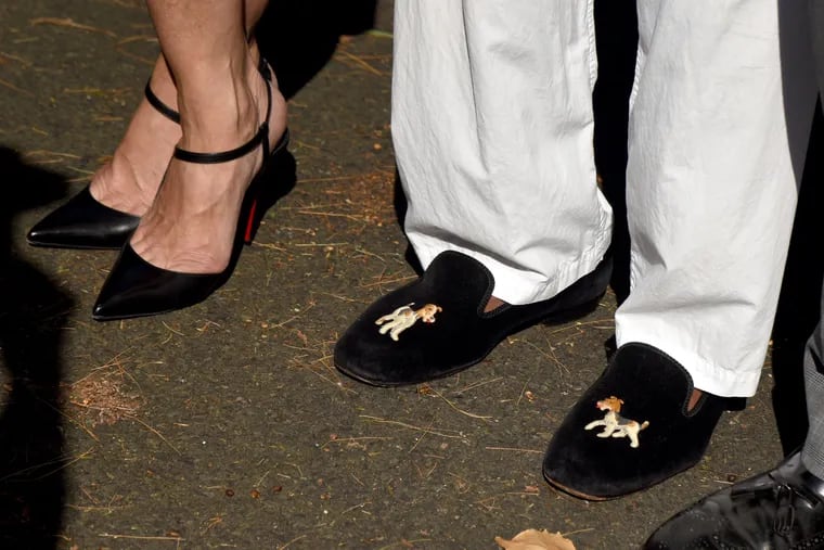 July 5, 2021: The embroidered footwear of comedian Bill Cosby (right) as he makes his first public appearance, standing with his attorneys outside his Elkins Park home on Wednesday following his release from prison after the Pennsylvania Supreme Court overturned his 2018 sexual assault conviction.
