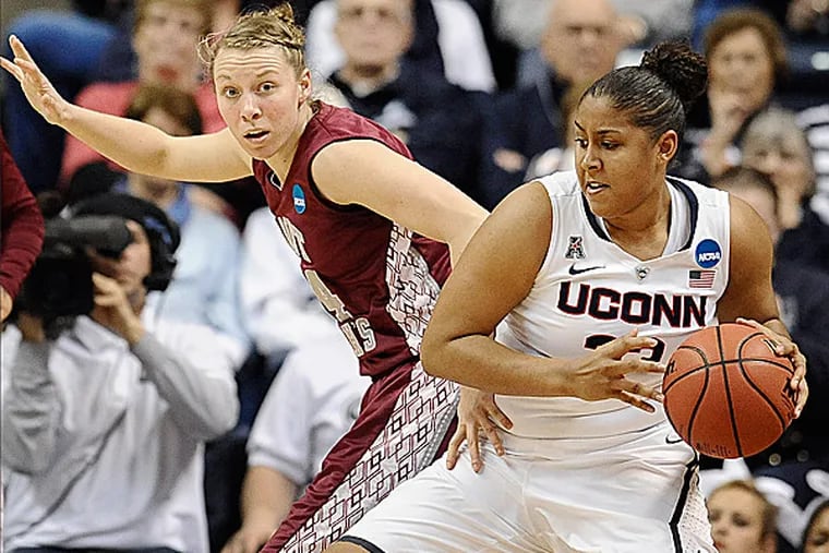 Connecticut's Kaleena Mosqueda-Lewis is guarded by Saint Joseph's
Kelsey Berger during the first half. (Jessica Hill/AP)