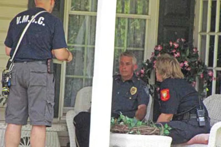 Eric Schmitz , a Hatfield Township police lieutenant, sits on the porch of his Towamencin home after the shooting. (Photo credit: Andy Stettler)