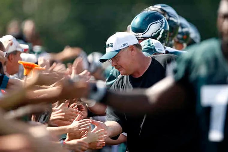 Andy Reid and Eagles players shake hands with fans on last day of training camp.