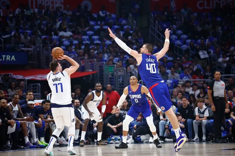 Luka Doncic #77 of the Dallas Mavericks takes a shot against Ivica Zubac #40 of the LA Clippers in the first half during game one of the Western Conference First Round Playoffs at Crypto.com Arena on April 21, 2024 in Los Angeles, California.
