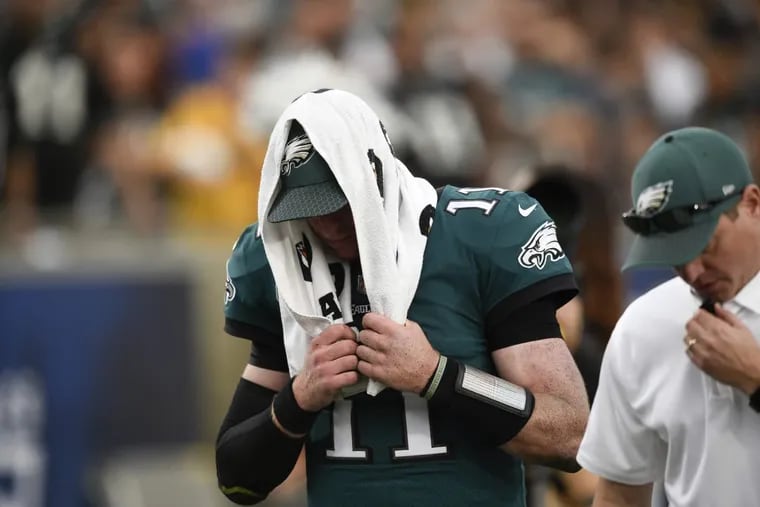 Philadelphia Eagles quarterback Carson Wentz leaves the field during the second half of an NFL football game against the Los Angeles Rams Sunday, Dec. 10, 2017, in Los Angeles. (AP Photo/Kelvin Kuo)