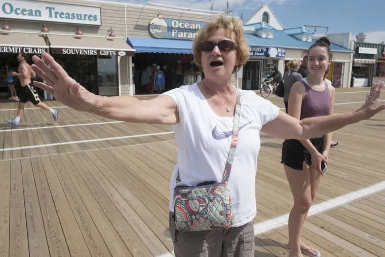 On the boardwalk in Ocean City, husband and wife Kathy and Joe Falco of Sewell NJ  had slightly different opinions of the Shore. She love, love loves it, and he hates it on holidays and weekends.