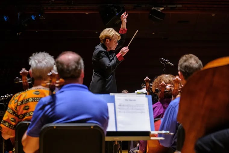 Marin Alsop conducting the Philadelphia Orchestra at its Pride Concert in Verizon Hall in June 2023. She will lead this year's Pride Concert on June 25 at 7 p.m. in what will be Marian Anderson Hall.