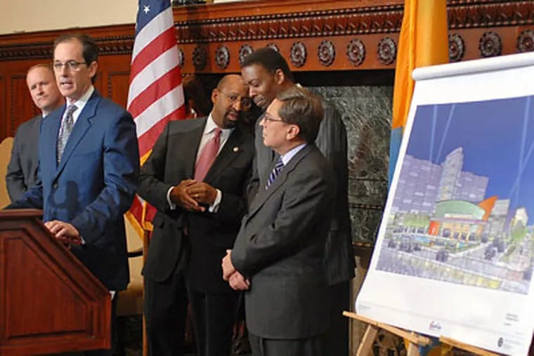 President and COO of SugarHouse Casino Bob Sheldon (at podium) unveils design changes for its waterfront casino during press conference at City Hall. (Tom Gralish / Staff Photographer)
