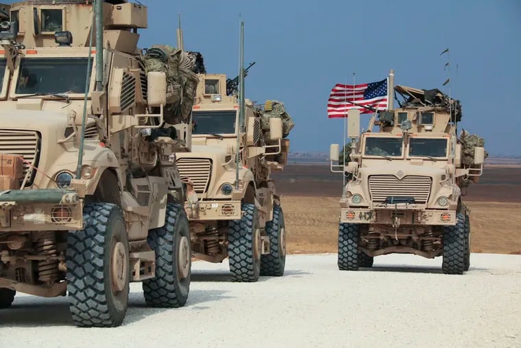 American military convoy stops near the town of Tel Tamr, north Syria, Sunday, Oct. 20, 2019. Kurdish-led fighters and Turkish-backed forces clashed sporadically Sunday in northeastern Syria amid efforts to work out a Kurdish evacuation from a besieged border town, the first pull-back under the terms of a U.S.-brokered cease-fire.