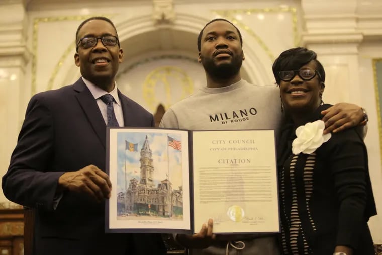 Council President Darrell L. Clarke (from left), Meek Mill, and Councilmember Cherelle L. Parker hold the proclamation that states the city of Philadelphia will designate March 14th and 15th as "Meek Mill Weekend" on March 14, 2019.