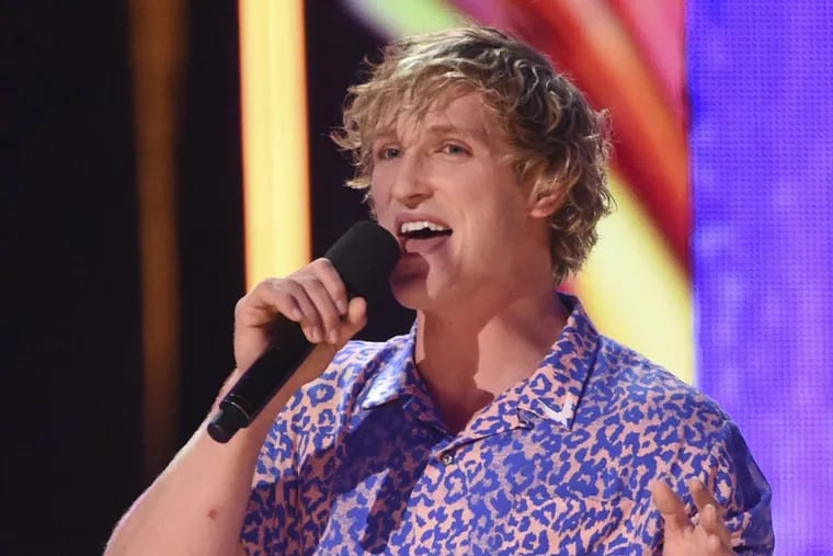 In this Aug. 13, 2017, file photo, Logan Paul introduces a performance by Kyle &amp; Lil Yachty and Rita Ora at the Teen Choice Awards at the Galen Center in Los Angeles.