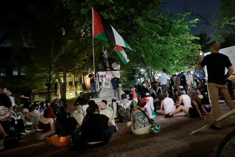 Hatem Bazian, president of American Muslims for Palestine (AMP), speaks at the encampment on the University of Pennsylvania's College Green Thursday night.