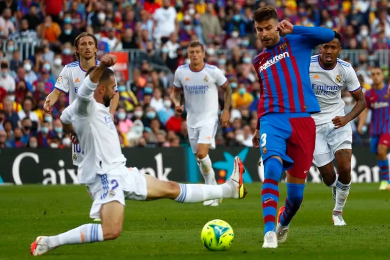 Real Madrid's Dani Carvajal, left, challenges Barcelona's Gerard Pique during the teams' La Liga meeting in Barcelona on Oct. 24. The teams meet in the Spanish SuperCup this week.