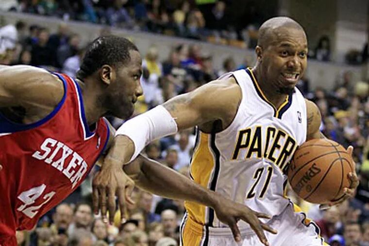 The Pacers' David West drives to the basket against Elton Brand during the second half on Saturday. (Darron Cummings/AP)