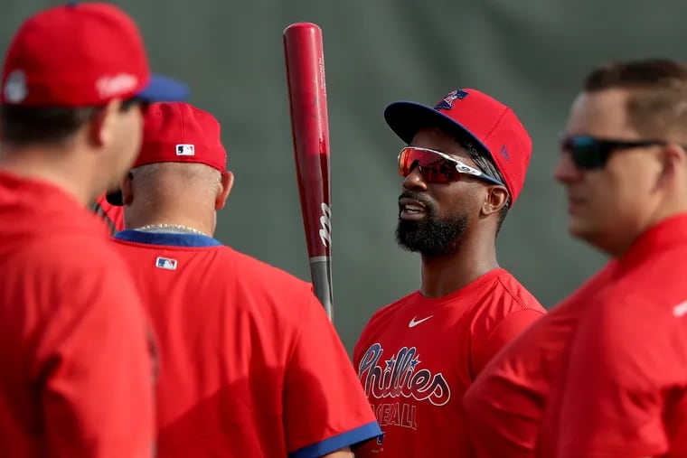 Andrew McCutchen talks with his teammates during Phillies spring training in Clearwater, FL on February 14, 2020.