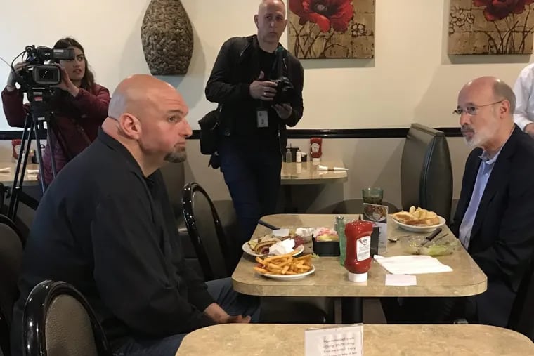 New Democratic nominee for lieutenant governor, Braddock mayor John Fetterman, meets the top of the ticket, Gov. Wolf, at a diner in Manchester, Pa. Wednesday.