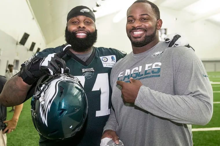 Jason Peters (left) and Fletcher Cox, shown here after a 2016 training camp practice, made the NFL All-Decade Team. CHARLES FOX / Staff Photographer