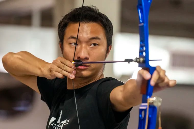 Yuan Jie Wen practices at his Callowhill Archery range.
