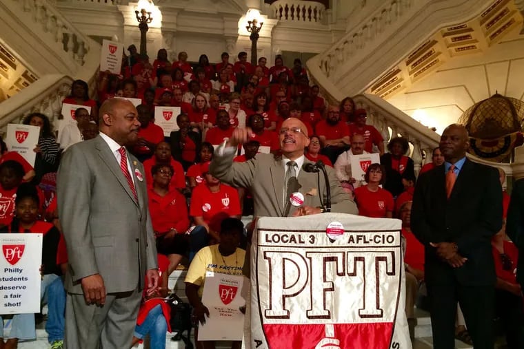 State Sen. Vincent Hughes (D., Phila.) speaks at a rally for Philadelphia school funding in Harrisburg in 2015. Flanking him are Jerry Jordan (left) of the Philadelphia Federation of Teachers and State Rep. Stephen Kinsey (D., Phila.).