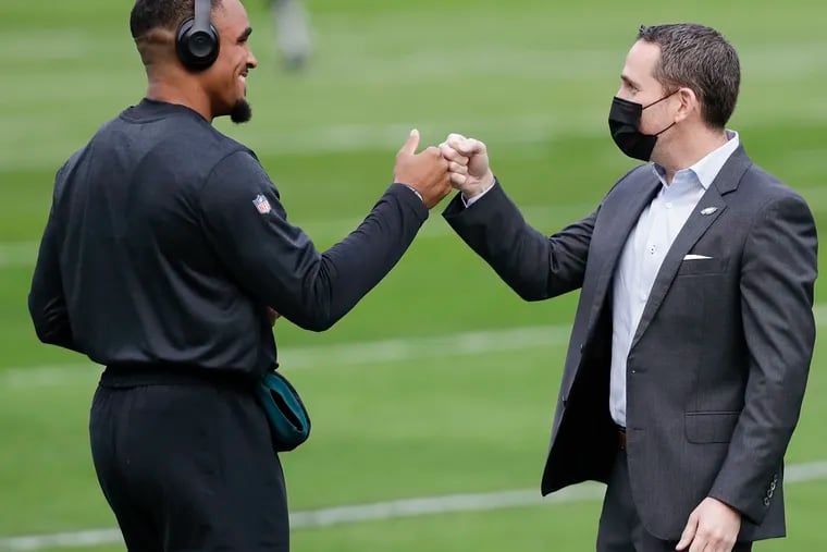 Eagles quarterback Jalen Hurts meets with Executive Vice President and General Manager Howie Roseman during warm ups before the Eagles play the New Orleans Saints on Sunday, December 13, 2020.