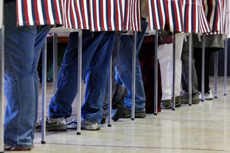 Voters fill the polling booths on Tuesday, Nov. 6, 2012 in Montpelier, Vt.  (AP Photo/Toby Talbot)