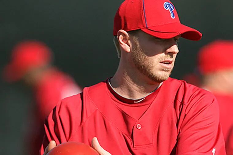 Phillies' pitchers Roy Halladay warms-up during spring training workouts at Bright House Field in Clearwater. (Yong Kim / Staff Photographer)