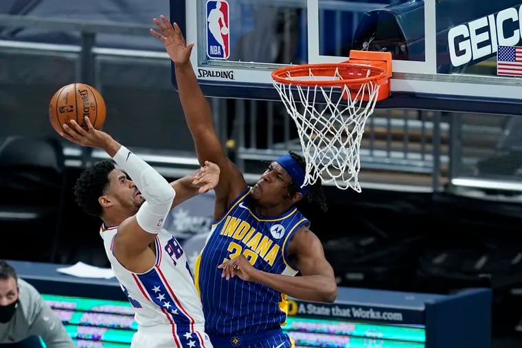 Philadelphia 76ers' Tobias Harris (12) puts up a shot against Indiana Pacers' Myles Turner (33) during the first half of an NBA basketball game, Sunday, Jan. 31, 2021, in Indianapolis. (AP Photo/Darron Cummings)