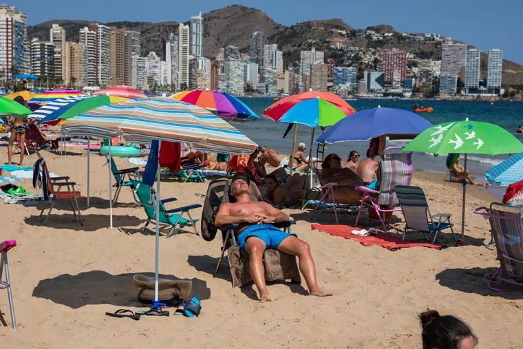 Tourists filled the Levante beach in Benidorm on Saturday as a heat wave swept across Spain.