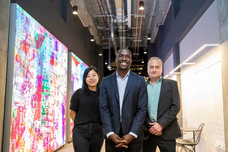 Nickl CEO Sumorwuo Zaza (center) with Jane Lee (left) and Theodore Economy at the Comcast Technology Center. The startup, relocating from Brooklyn to Philly, offers businesses a way to access articles behind publishers’ paywalls.