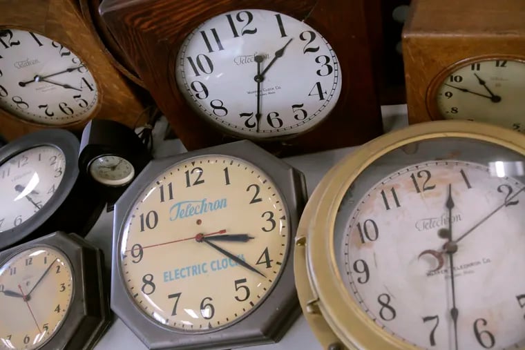 Antique clocks at the Electric Time Co. in Massachusetts display different times. Most clocks in the nation will move up an hour early Sunday. Will your body know what time it is?
