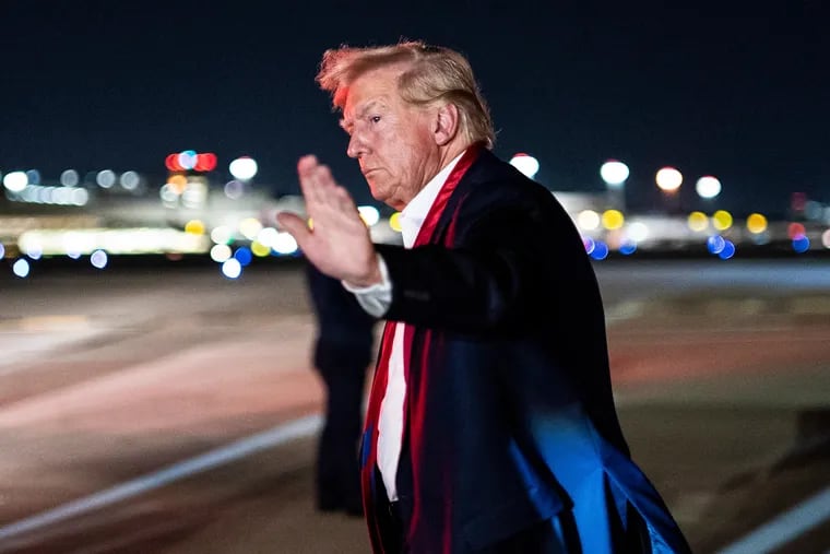 Former president Donald Trump disembarks his airplane, known as "Trump Force One," after speaking at a campaign event in April.