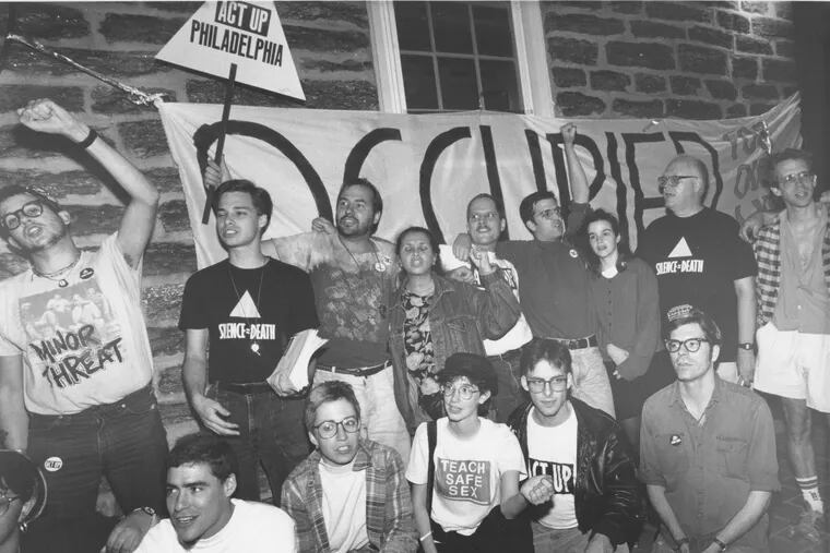 Occupation of nursing home building by ACT UP persons. Group chants on porch in front of occupied banner. October 5th, 1990. Chris Gardner / AP