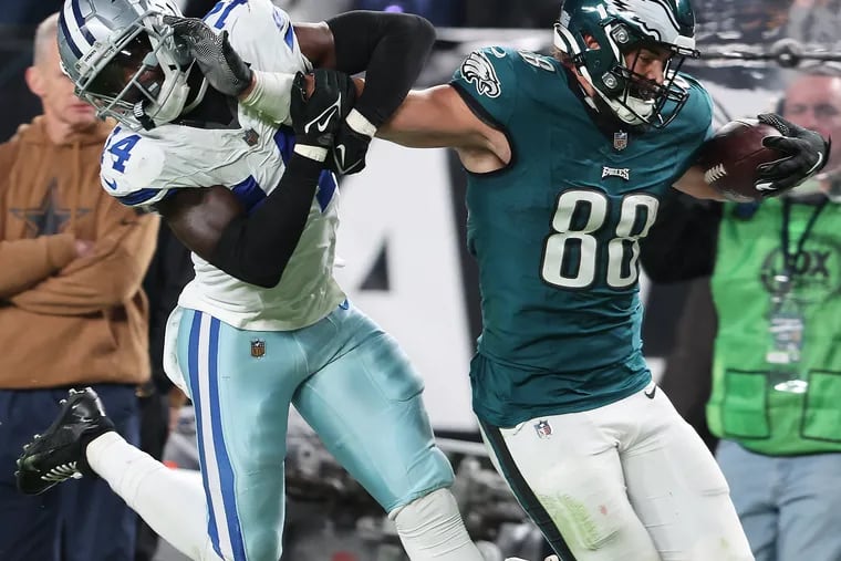 Dallas Cowboys safety Markquese Bell gets tangled up with Eagles tight end Dallas Goedert as he makes a first-down catch in the third quarter. Goedert suffered a broken forearm on the play.