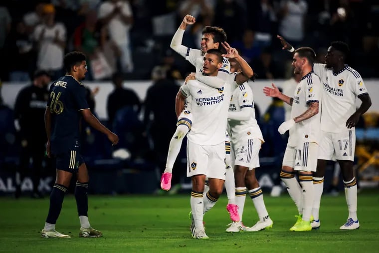 Riqui Puig (center rear) celebrates his goal for the Galaxy against the Union.