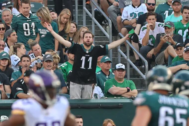 An Eagles fan cannot contain his frustration with the offense and penalties during the second quarter in the loss to the Vikings.