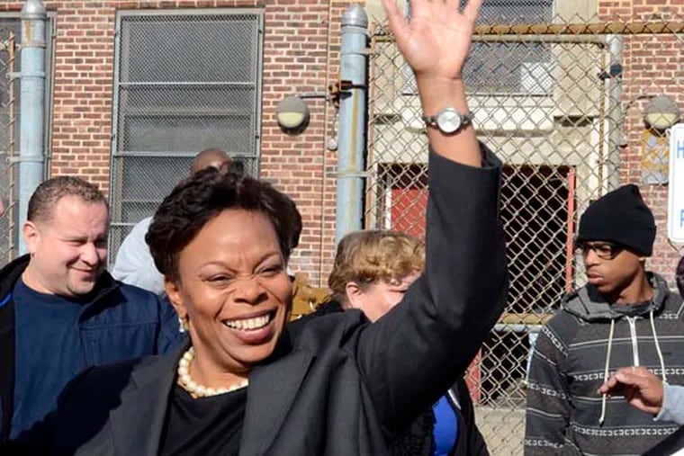 Incumbent Mayor Dana L. Redd waves to supporters as she leaves her polling place after voting at the Yorkship School in Camden November, 5, 2013. ( TOM GRALISH / Staff Photographer )